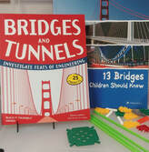 Bridge building kit with two books and Knex building pieces